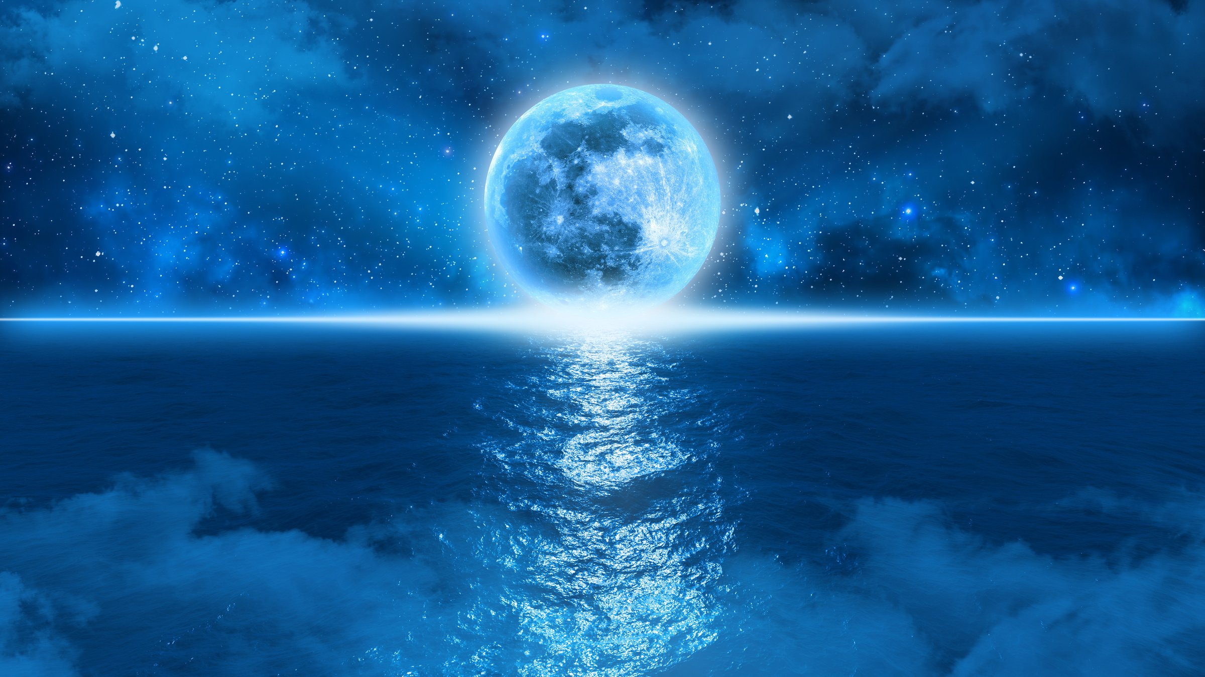 mysterious blue moon touches the horizon